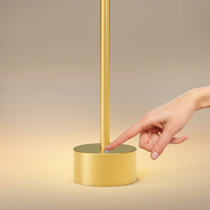 Chic gold-tone cordless LED lamp with wireless functionality for versatile interior illumination