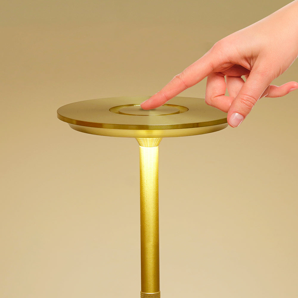 Sleek gold-finish cordless LED table lamp offering versatile and contemporary lighting solution